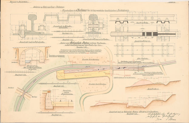 Altes Buch mit detaillierten Zeichnungen und Text eines Eisenbahnlayouts, einschließlich einer Zuggleis-Illustration.