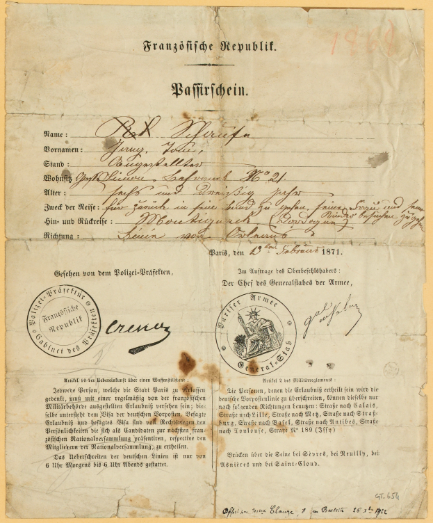 Ein altes, vergilbtes Dokument mit einem kreisrunden, schwarz umrandeten Stempel, wahrscheinlich ein Brief der deutschen Regierung, geschrieben in schwarzer Tinte.