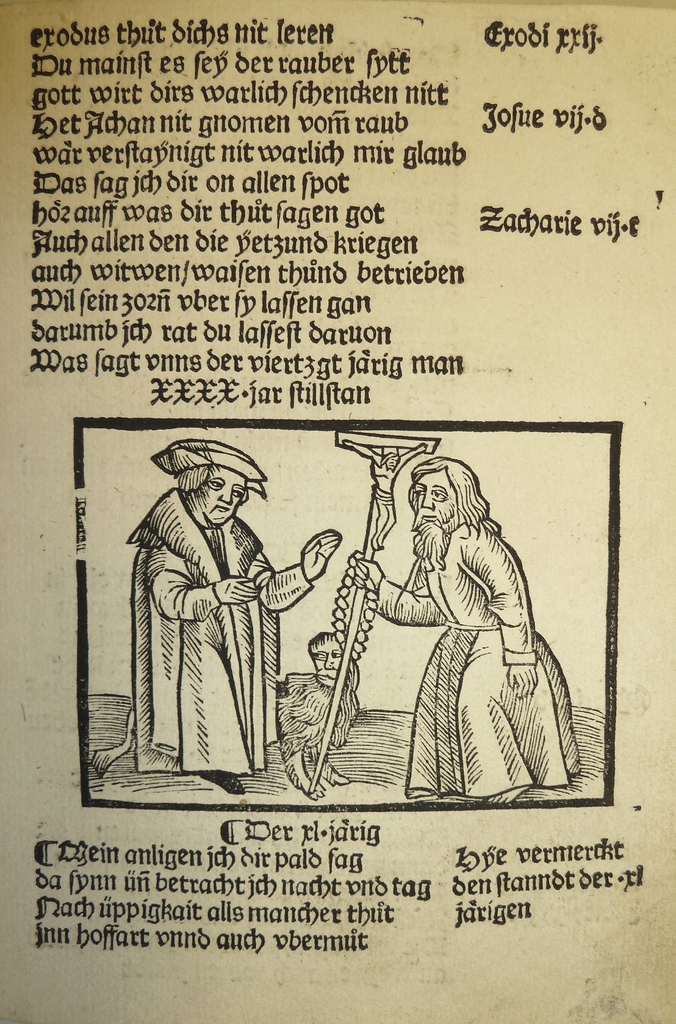 Ein Blatt Papier mit gedrucktem Text in einer fremden Sprache, mit zwei Männern im Hintergrund, möglicherweise aus einem Schulbuch.