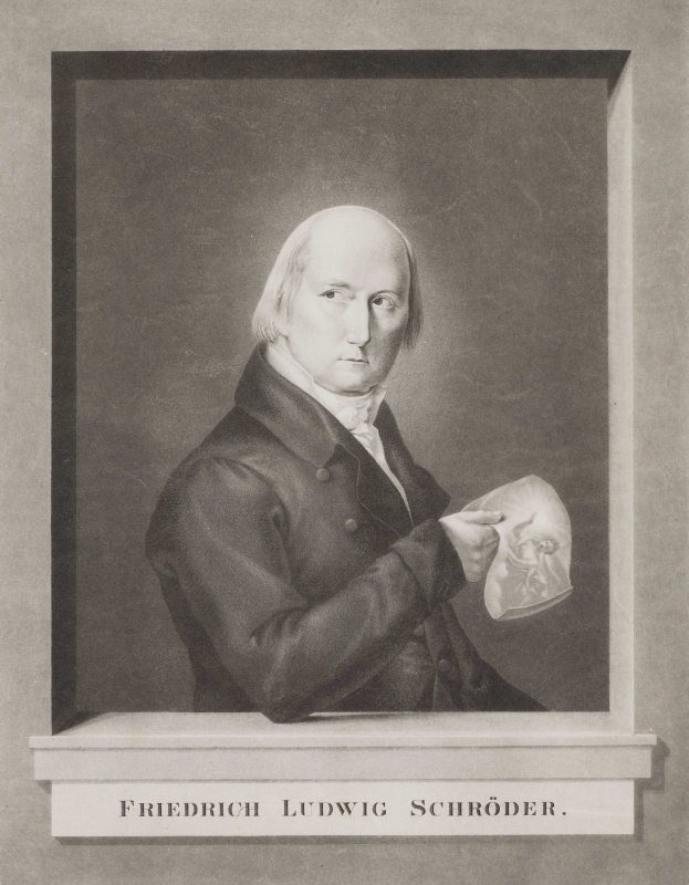 Ein Schwarz-Wei├č-Foto von Friedrich Ludwig Schr├Âder, einem deutschen Komponisten, der einen Anzug tr├Ągt und ein Blatt Papier h├Ąlt, mit einem ernsten Gesichtsausdruck und konzentriertem Blick.